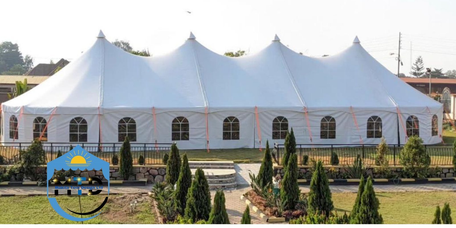 Guest seating arranged under a pitched marquee